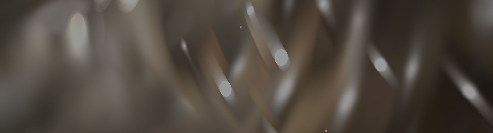 Abstract swirling shapes with soft lighting.