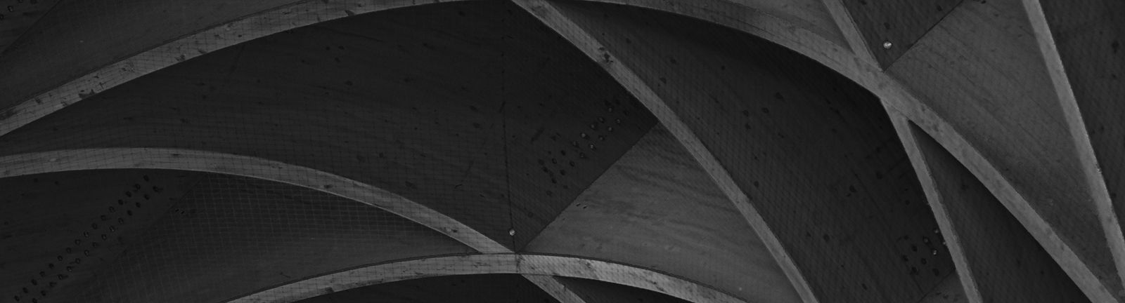 Architectural wood arch details in black and white.